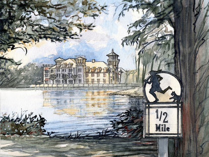 Watercolor painting of the Half Mile lakeside path in Celebration Florida with trees, reflections on the water and iconic architecture